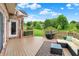 Back deck with furniture, overlooking trees and yard at 5377 Crooked Stick Ct, Greenwood, IN 46142