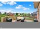 Large, fenced backyard with lush greenery, mature trees, and a view of surrounding houses at 5377 Crooked Stick Ct, Greenwood, IN 46142
