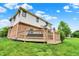 A cozy backyard deck is showcased with a pristine lawn and inviting outdoor space perfect for relaxation at 5377 Crooked Stick Ct, Greenwood, IN 46142