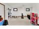 Versatile basement with exercise equipment, play areas, and ample space for various activities, perfect for recreation at 5377 Crooked Stick Ct, Greenwood, IN 46142