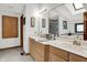 Bright bathroom with a double vanity, a large mirror and access to the walk-in shower and soaking tub at 5377 Crooked Stick Ct, Greenwood, IN 46142