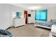 Bright bedroom with modern furnishings, carpet flooring and a decorative accent wall at 5377 Crooked Stick Ct, Greenwood, IN 46142