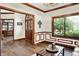 Elegant entryway with hardwood floors, decorative molding, and a charming wooden door with glass panels at 5377 Crooked Stick Ct, Greenwood, IN 46142