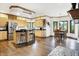 Spacious eat-in kitchen with light wood cabinetry, stainless steel appliances, and breakfast bar at 5377 Crooked Stick Ct, Greenwood, IN 46142