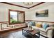 Cozy living room featuring a neutral sofa with throw pillows, hardwood floors, and decorative molding at 5377 Crooked Stick Ct, Greenwood, IN 46142