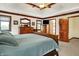 Spacious bedroom with wood trim, neutral walls, and doorway access to the hallway, bathroom, and closet at 5377 Crooked Stick Ct, Greenwood, IN 46142