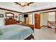 Bright and airy main bedroom featuring wood trim, a tray ceiling and doorway access to the upper level at 5377 Crooked Stick Ct, Greenwood, IN 46142