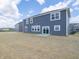 Exterior of a two-story home featuring a sliding glass door in the backyard at 5540 Tart Blvd, Indianapolis, IN 46239