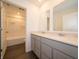 Modern bathroom with double vanity, quartz countertops, and a shower-tub combo at 5540 Tart Blvd, Indianapolis, IN 46239