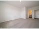 Bright bedroom featuring neutral carpeting, white walls, and a doorway leading to an attached bathroom at 5540 Tart Blvd, Indianapolis, IN 46239