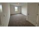 Carpeted bedroom filled with natural light, showcasing neutral walls and a bright, airy atmosphere at 5540 Tart Blvd, Indianapolis, IN 46239