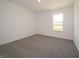 Bedroom featuring a large window overlooking a green space at 5540 Tart Blvd, Indianapolis, IN 46239