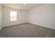 Bright bedroom featuring a large window overlooking a green space at 5540 Tart Blvd, Indianapolis, IN 46239