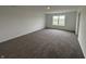 Expansive bedroom with neutral walls, carpeted flooring, and bright natural light, offering a blank canvas at 5540 Tart Blvd, Indianapolis, IN 46239