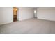 Bright bedroom featuring neutral carpeting, white walls, and a doorway leading to the bathroom at 5540 Tart Blvd, Indianapolis, IN 46239