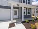 Close-up of the home's entry, highlighting the covered porch and well-kept landscaping at 5540 Tart Blvd, Indianapolis, IN 46239