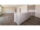 Open-concept kitchen features a large island, plenty of cabinet space and luxury vinyl plank flooring at 5540 Tart Blvd, Indianapolis, IN 46239