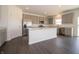 Modern kitchen with stainless steel appliances, large center island, and gray cabinets with stone countertops at 5540 Tart Blvd, Indianapolis, IN 46239