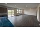 Bright, spacious kitchen area with sliding glass doors, multiple windows, and modern gray cabinets and countertops at 5540 Tart Blvd, Indianapolis, IN 46239