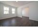 Bright living room with large windows and modern flooring, offering an open and airy atmosphere at 5540 Tart Blvd, Indianapolis, IN 46239