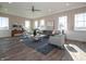 Comfortable living room with a large sofa, chairs, and a well-lit area with many windows at 5540 Tart Blvd, Indianapolis, IN 46239