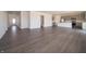 Expansive open floor plan featuring sleek flooring and a modern kitchen with stainless steel appliances at 5540 Tart Blvd, Indianapolis, IN 46239