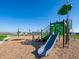 Community playground with slide, swings, and green space for to play at 5540 Tart Blvd, Indianapolis, IN 46239