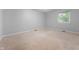 Neutral carpet and neutral walls in bedroom provide bright and comfortable atmosphere at 5601 W Sun Point Dr, Muncie, IN 47304