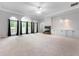 Open living area featuring a fireplace, recessed lighting, built-in cabinets, and large windows for natural light at 5601 W Sun Point Dr, Muncie, IN 47304