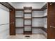 Open walk-in closet with shelves and rack is spacious and well-organized at 5601 W Sun Point Dr, Muncie, IN 47304