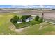 Aerial view of the house with a detached garage and a fenced yard surrounded by open fields at 5855 S 25 W, Lebanon, IN 46052