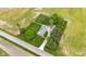 Aerial view of home with a well-maintained lawn, mature trees, and a surrounding rural landscape at 5855 S 25 W, Lebanon, IN 46052