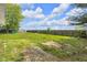 Expansive backyard with a well-maintained lawn, a wooden fence, and plenty of space at 5855 S 25 W, Lebanon, IN 46052