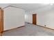 Basement area features neutral carpeting, white walls, and warm wood trim at 5855 S 25 W, Lebanon, IN 46052