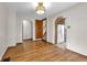Spacious dining room with hardwood flooring, archways and access to the kitchen at 5855 S 25 W, Lebanon, IN 46052