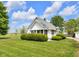 Charming home with white siding and a well-manicured lawn on a sunny day at 5855 S 25 W, Lebanon, IN 46052