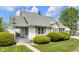 Exterior view of the home's landscaping with a detached garage and white siding at 5855 S 25 W, Lebanon, IN 46052