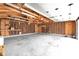 Spacious garage with exposed beams, storage shelves, and ample room for vehicles at 5855 S 25 W, Lebanon, IN 46052