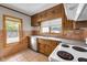 Traditional kitchen features wood cabinets, stainless dishwasher, and a window with a view at 5855 S 25 W, Lebanon, IN 46052