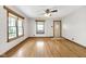 Living room featuring hardwood floors, natural lighting, and a classic ceiling fan at 5855 S 25 W, Lebanon, IN 46052