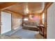 Inviting living space with wood walls, sofa, and an American flag for a patriotic touch at 5855 S 25 W, Lebanon, IN 46052
