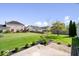 Backyard with lush green lawn, a patio, and well-maintained landscaping at 5893 Crosscut Ln, Noblesville, IN 46062