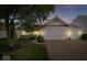 Charming single-Gathering home featuring an attached two-car garage, well-maintained lawn, and mature trees at 5893 Crosscut Ln, Noblesville, IN 46062