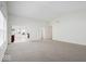 Bright and spacious living room featuring neutral carpeting with views of the backyard at 5893 Crosscut Ln, Noblesville, IN 46062