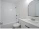 Stylish bathroom with tub, shower, and white subway tile at 5938 Dunseth Ct, Indianapolis, IN 46254