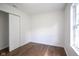 Minimal bedroom featuring hardwood floors and a window for natural light at 5938 Dunseth Ct, Indianapolis, IN 46254