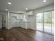 Modern kitchen with white cabinets, subway tile backsplash, granite countertops, and stainless steel appliances at 5938 Dunseth Ct, Indianapolis, IN 46254