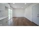 Bright living room featuring hardwood floors and sliding glass doors leading to backyard at 5938 Dunseth Ct, Indianapolis, IN 46254