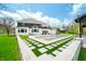 Gorgeous backyard featuring a pool area, lush artificial turf, and a meticulously landscaped backyard at 5990 Hollow Ct, Bargersville, IN 46106