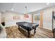 Basement with a pool table, plush carpet, and a light fixture hanging from the ceiling at 5990 Hollow Ct, Bargersville, IN 46106